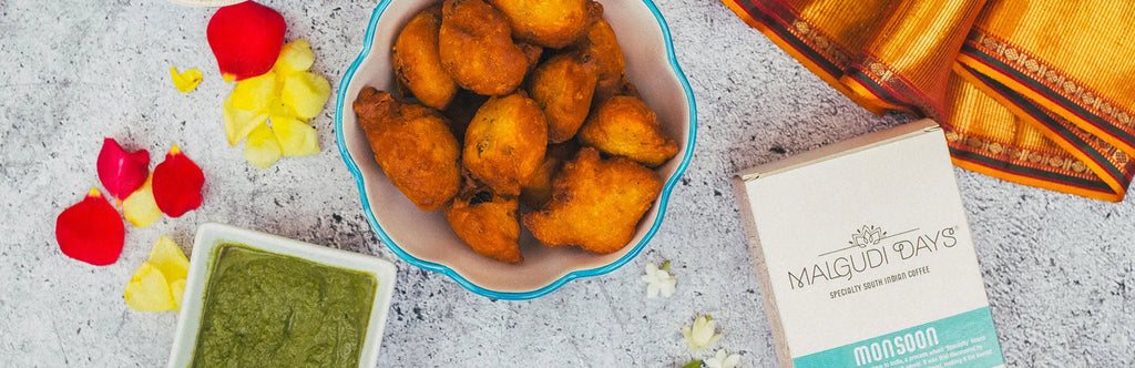 Mysore bonda or bajji served in a bowl with mint chutney and filter coffee